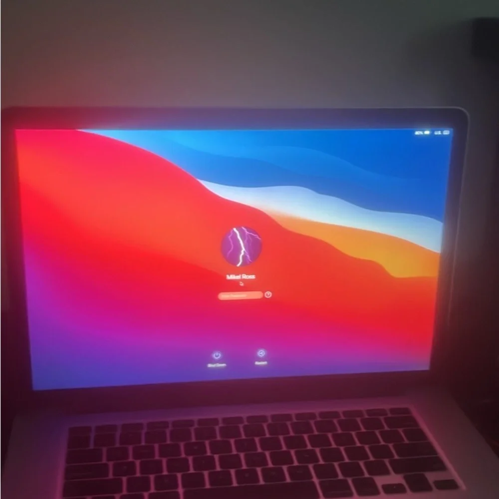 Apple Laptop with Red and Blue Keyboard Glow